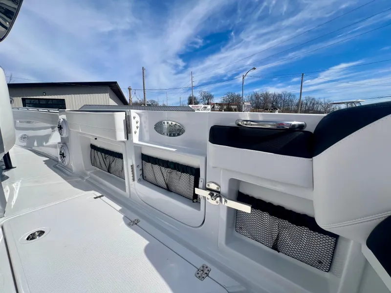 Slide: The Image of 2025 Nor-Tech 390 Sport Center Console boat interior with storage compartments and sleek design. - 6