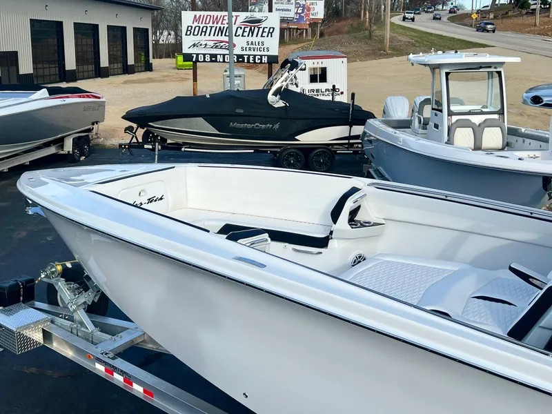 Slide: The Image of 2025 Nor-Tech 390 Sport Center Console boat displayed at Midwest Boating Center. - 7