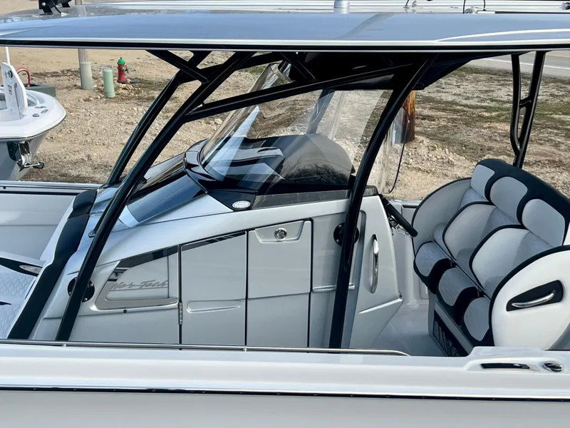 Slide: The Image of 2025 Nor-Tech 390 Sport Center Console boat with sleek design and comfortable seating. - 8
