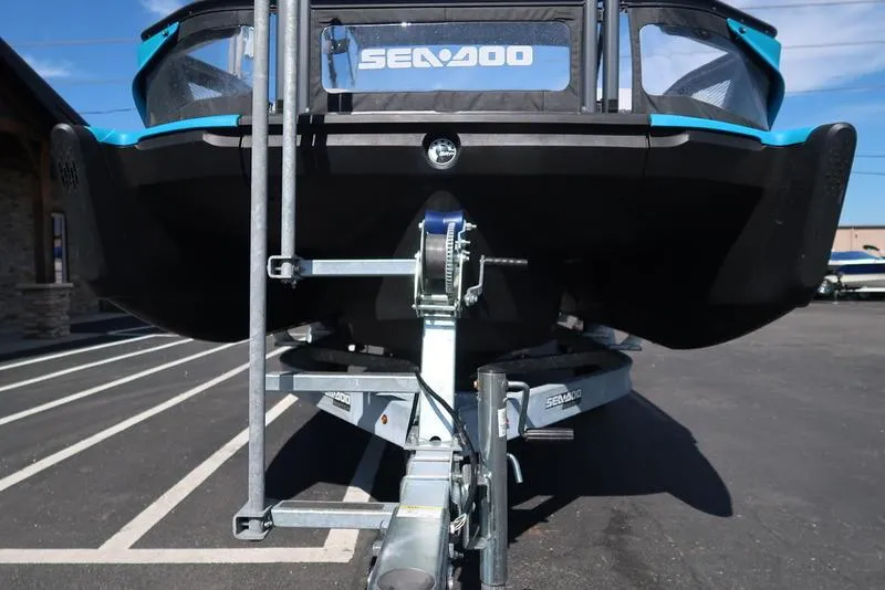 Slide: The Image of 2023 Sea-Doo Switch® Sport 21-230 hp on trailer, front view in parking lot. - 10