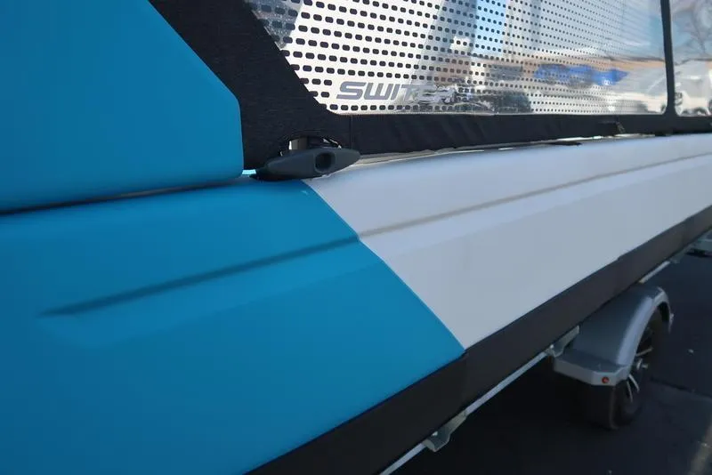 Slide: The Image of 2023 Sea-Doo Switch® Sport 21-230 hp Galvanized, close-up of blue and white exterior. - 13