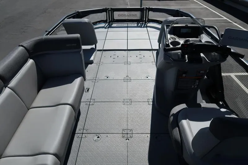 Slide: The Image of 2023 Sea-Doo Switch® Sport 21-230 hp Galvanized boat interior with seating and controls. - 17