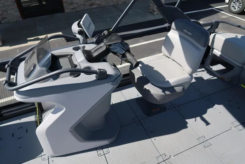 Slide: The Image of 2023 Sea-Doo Switch® Sport 21-230 hp Galvanized boat cockpit with steering and seating. - 22