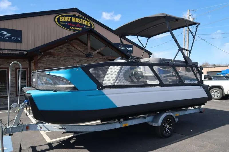 Slide: The Image of 2023 Sea-Doo Switch Sport 21-230 hp boat on trailer at dealership. - 3