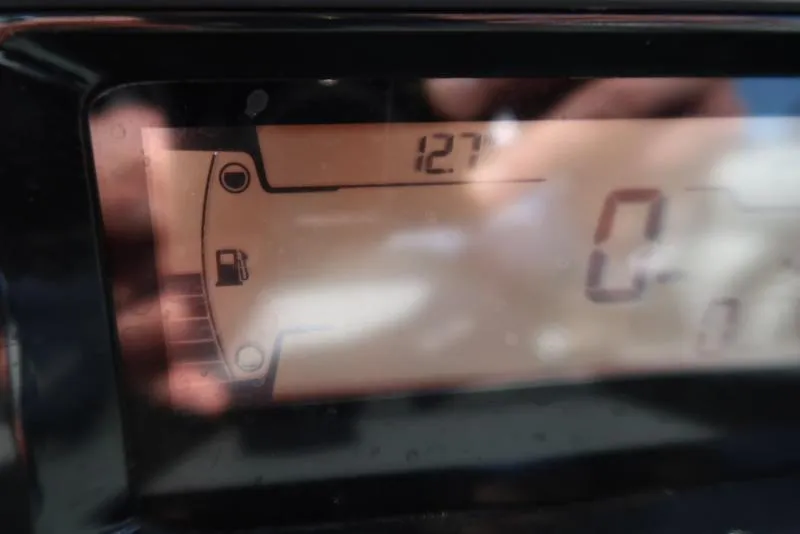 Slide: The Image of Dashboard display of 2023 Sea-Doo Switch® Sport 21-230 hp Galvanized, showing fuel gauge and speedometer. - 32