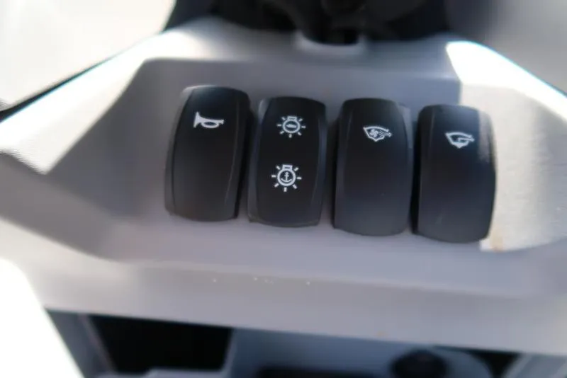 Slide: The Image of Control panel of 2023 Sea-Doo Switch® Sport 21-230 hp Galvanized with various switches. - 38