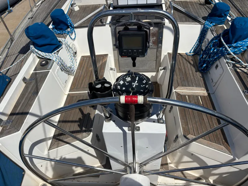 Slide: The Image of Cockpit of 1994 Nautor Swan 46 MK II sailboat with steering wheel and navigation instruments. - 15