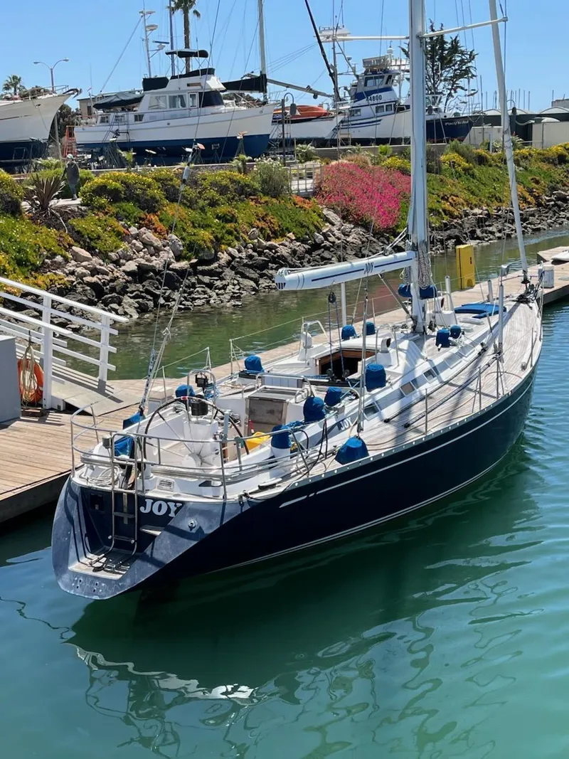Slide: The Image of Sailing yacht Nautor Swan 46 MK II, 1994, docked in a sunny marina. - 2