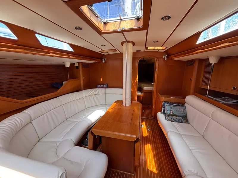 Slide: The Image of Luxurious interior of 1994 Nautor Swan 46 MK II yacht with white seating and wooden finishes. - 27