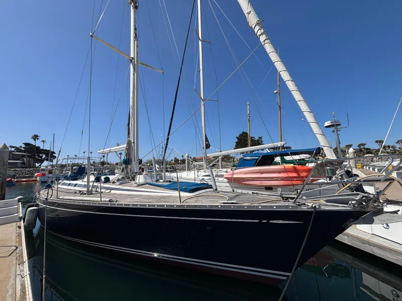 Slide: The Image of Sailing yacht Nautor Swan 46 MK II, 1994, docked in a marina under clear blue skies. - 3