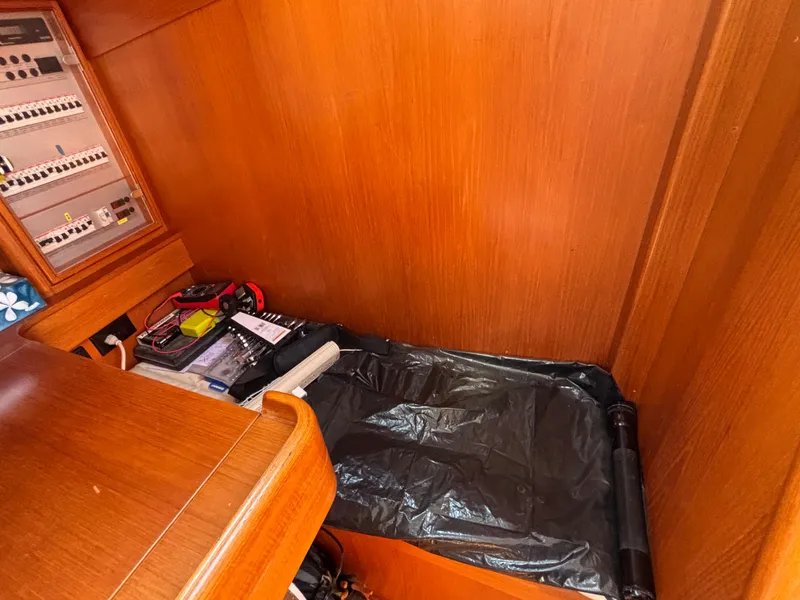 Slide: The Image of Nautor Swan 46 MK II 1994 yacht interior with wooden paneling and navigation equipment. - 37