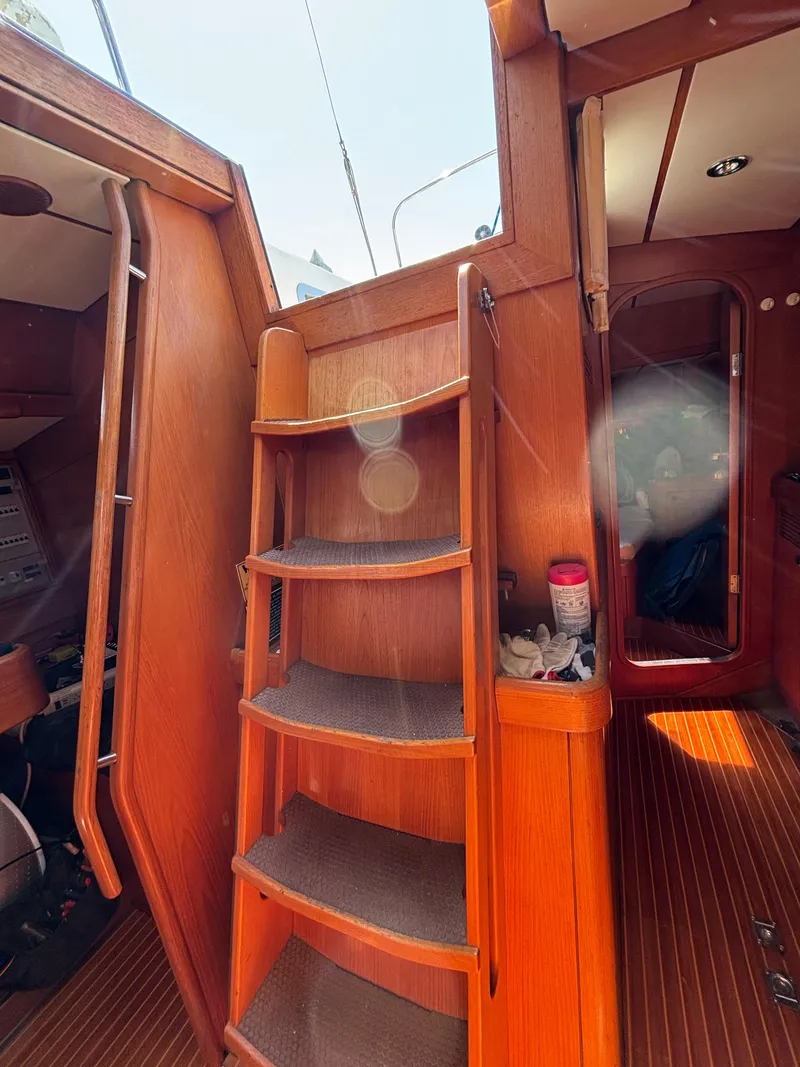 Slide: The Image of Interior of 1994 Nautor Swan 46 MK II sailboat with wooden steps and cozy cabin. - 38