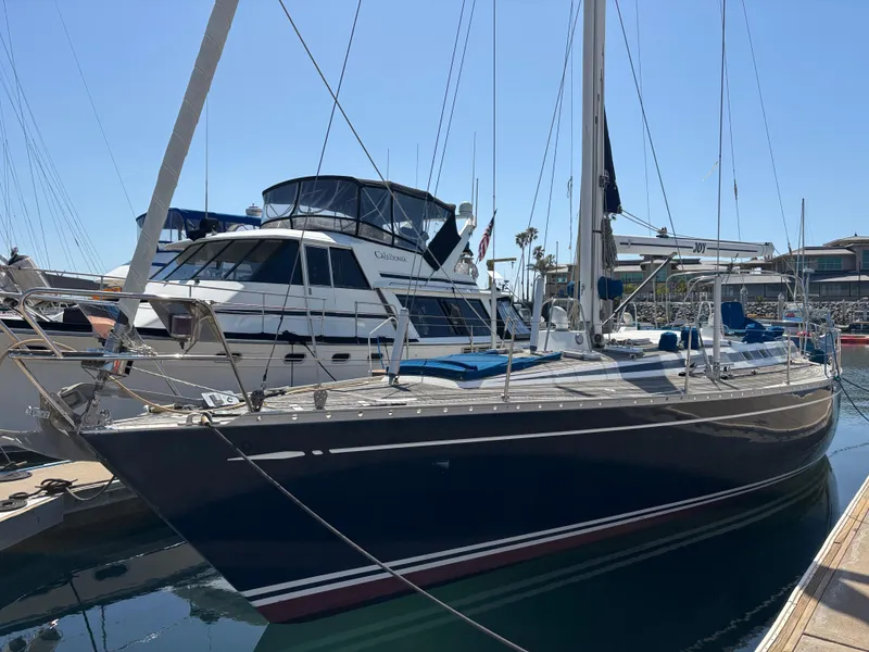 Slide: The Image of Sailing yacht Nautor Swan 46 MK II, 1994 model, docked at marina under clear sky. - 4