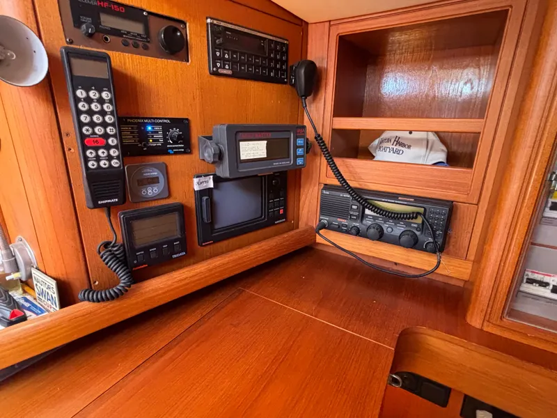 Slide: The Image of Navigation equipment on a 1994 Nautor Swan 46 MK II yacht, featuring communication devices and controls. - 40