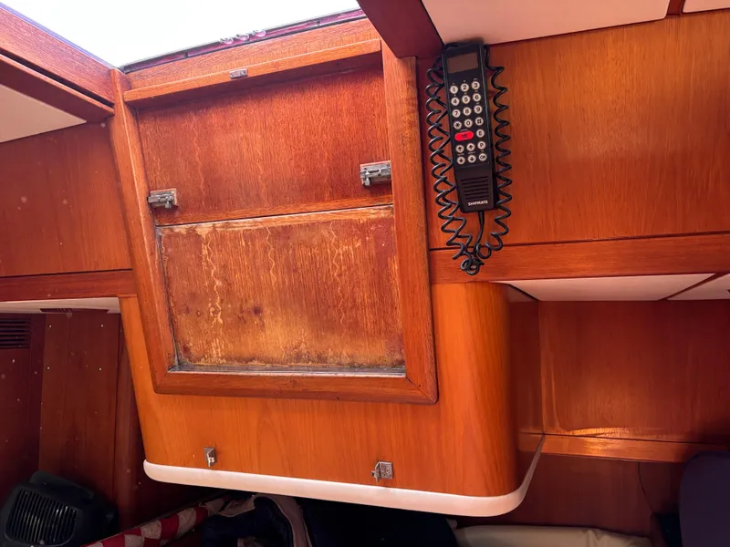 Slide: The Image of Interior of 1994 Nautor Swan 46 MK II yacht with wooden cabinetry and mounted radio. - 41