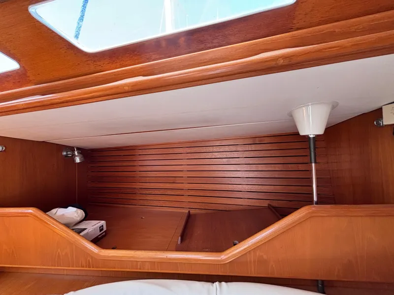 Slide: The Image of Interior cabin of 1994 Nautor Swan 46 MK II yacht with wooden finish and lighting. - 45