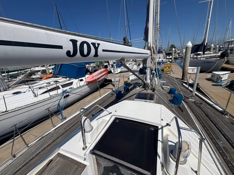 Slide: The Image of Sailboat Nautor Swan 46 MK II, 1994, docked at marina with clear blue sky. - 8