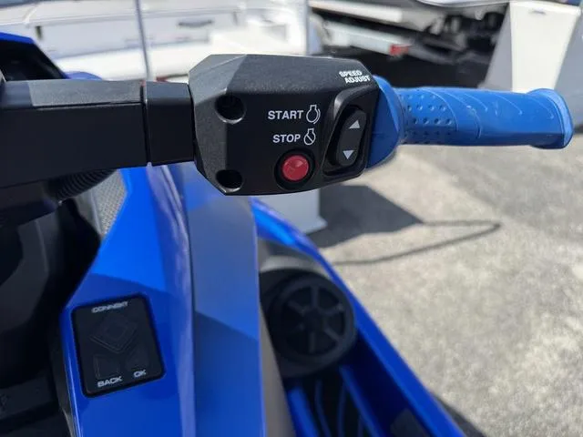 Slide: The Image of 2023 Yamaha WaveRunner GP1800R handlebar controls with start and stop buttons. - 11