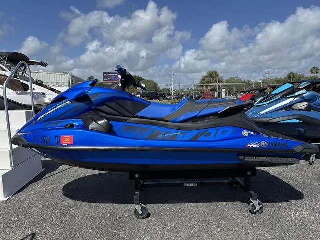 Slide: The Image of 2023 Yamaha WaveRunner GP1800R in vibrant blue, displayed outdoors on a sunny day. - 4