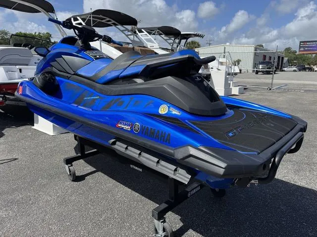 Slide: The Image of 2023 Yamaha WaveRunner GP1800R in blue, displayed outdoors on a stand. - 5