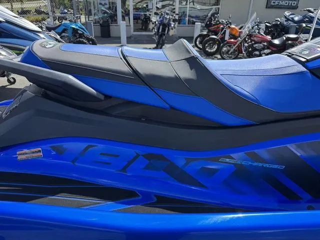 Slide: The Image of 2023 Yamaha WaveRunner GP1800R in vibrant blue, parked at a dealership. - 7