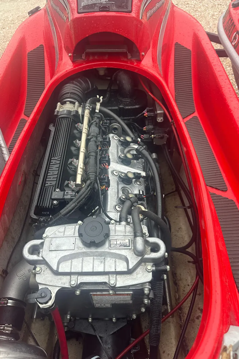Slide: The Image of 2006 Yamaha WaveRunner VX 110 Deluxe engine, red body, detailed view. - 11