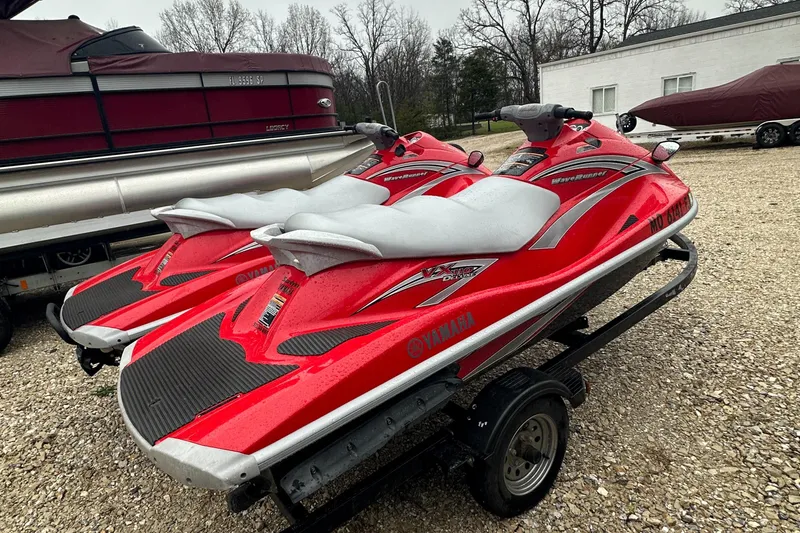 Slide: The Image of Two red 2006 Yamaha WaveRunner VX 110 Deluxe jet skis on a trailer. - 13