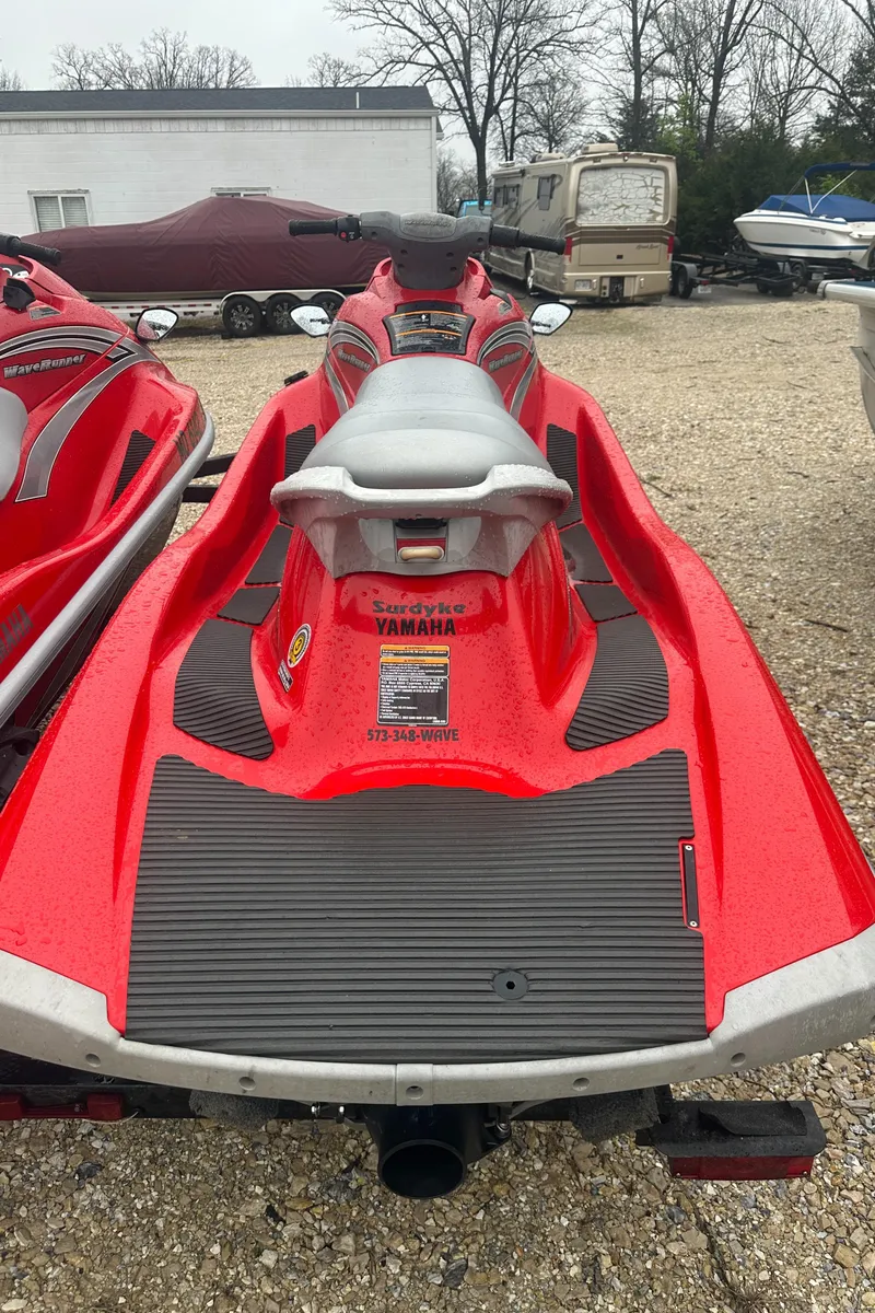 Slide: The Image of 2006 Yamaha WaveRunner VX 110 Deluxe in red, parked on gravel. - 16