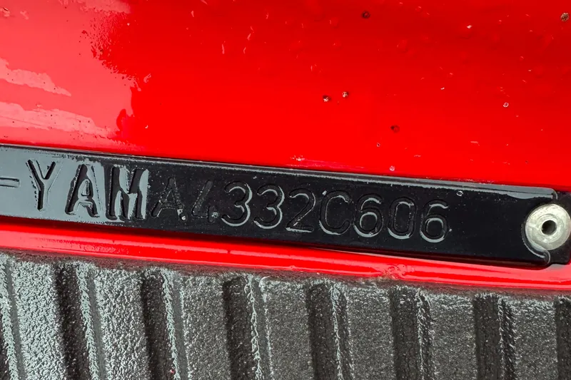 Slide: The Image of 2006 Yamaha WaveRunner VX 110 Deluxe hull identification number on red surface. - 18