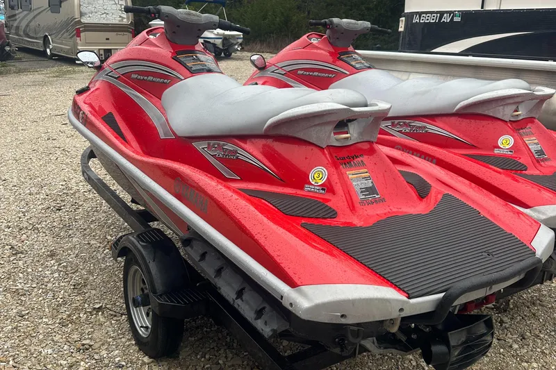 Slide: The Image of Two red 2006 Yamaha WaveRunner VX 110 Deluxe jet skis on a trailer. - 7