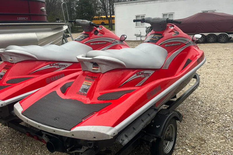 Slide: The Image of 2006 Yamaha WaveRunner VX 110 Deluxe, red, parked on trailer, outdoor setting. - 8