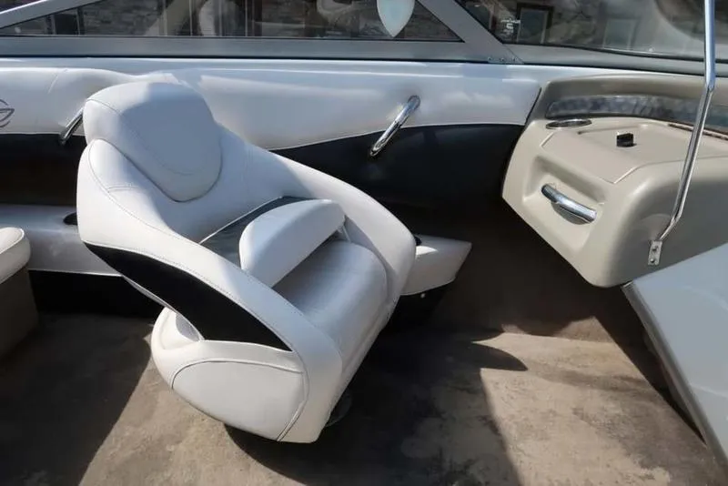 Slide: The Image of 2011 Crownline 18 SS boat interior with white and black seating. - 13