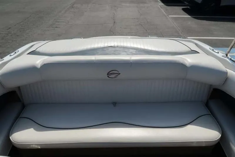 Slide: The Image of 2011 Crownline 18 SS boat interior with white seating and logo. - 4