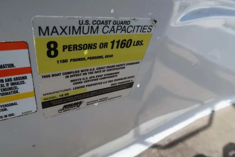 Slide: The Image of 2011 Crownline 18 SS capacity label: 8 persons or 1160 lbs maximum. - 9