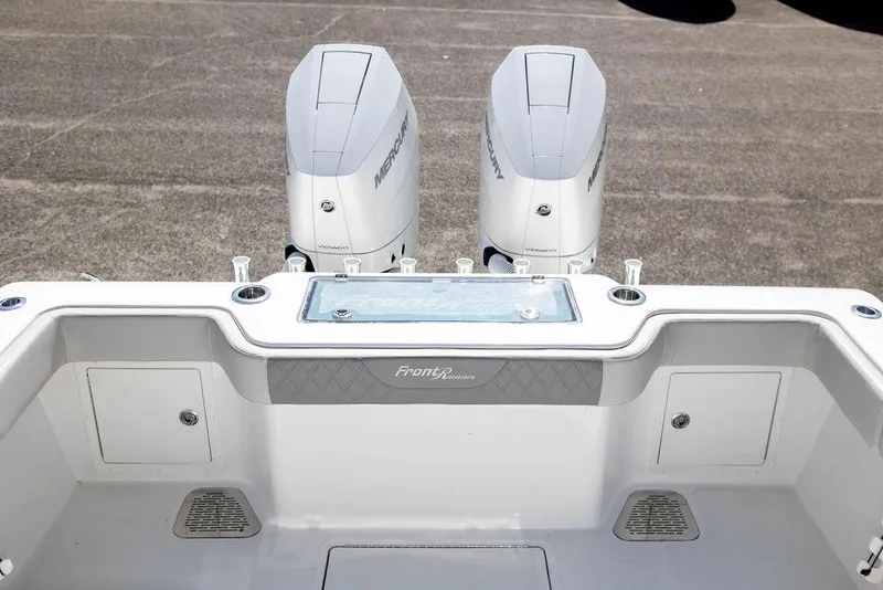 Slide: The Image of 2023 Front Runner 33 Center Console boat with dual outboard engines. - 11