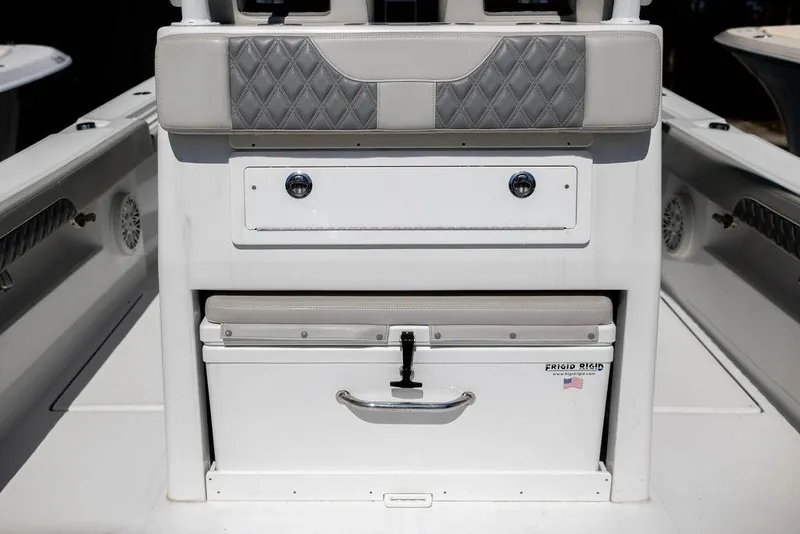 Slide: The Image of 2023 Front Runner 33 Center Console boat interior with storage compartments and cushioned seating. - 12