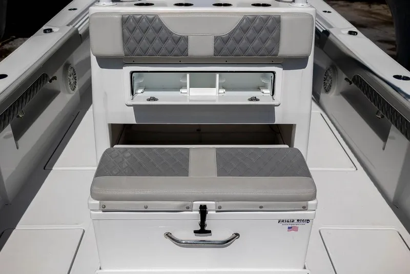 Slide: The Image of 2023 Front Runner 33 Center Console boat interior with cushioned seating and storage. - 13