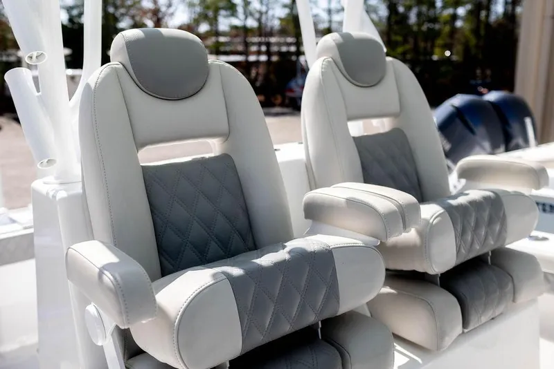 Slide: The Image of 2023 Front Runner 33 Center Console boat seats, featuring luxurious gray and white upholstery. - 14