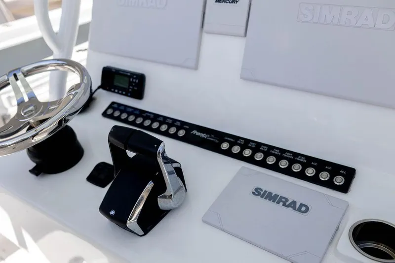 Slide: The Image of Control panel of 2023 Front Runner 33 Center Console boat with Simrad electronics. - 17