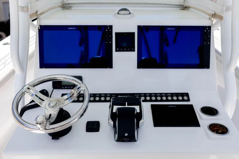 Slide: The Image of 2023 Front Runner 33 Center Console dashboard with dual screens and steering wheel. - 18