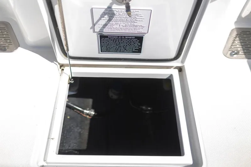 Slide: The Image of Open storage compartment on 2023 Front Runner 33 Center Console boat. - 23