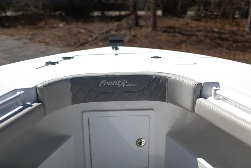 Slide: The Image of 2023 Front Runner 33 Center Console boat interior, featuring sleek design and storage compartment. - 28