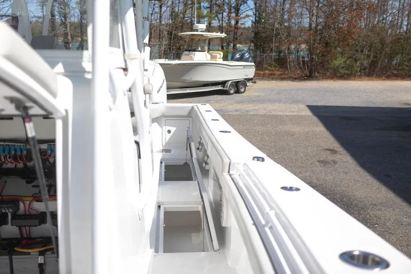 Slide: The Image of 2023 Front Runner 33 Center Console boat, detailed view of deck and storage compartments. - 29
