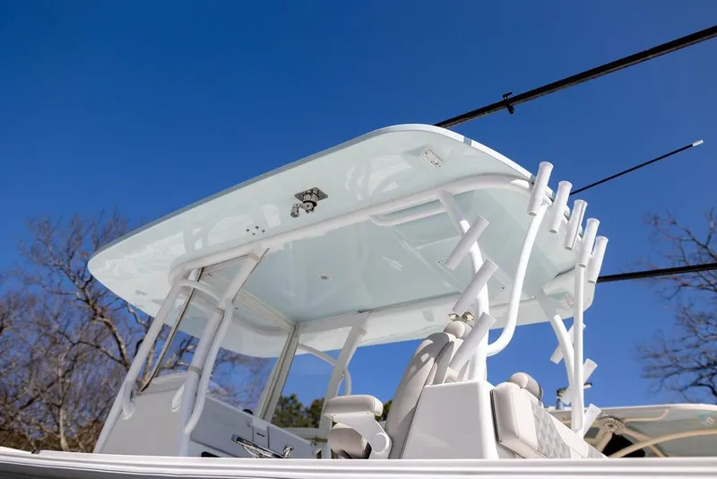 Slide: The Image of 2023 Front Runner 33 Center Console boat with T-top against clear blue sky. - 9