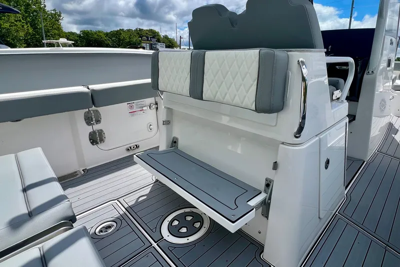 Slide: The Image of 2024 Everglades 285 Center Console boat interior with seating and storage features. - 10