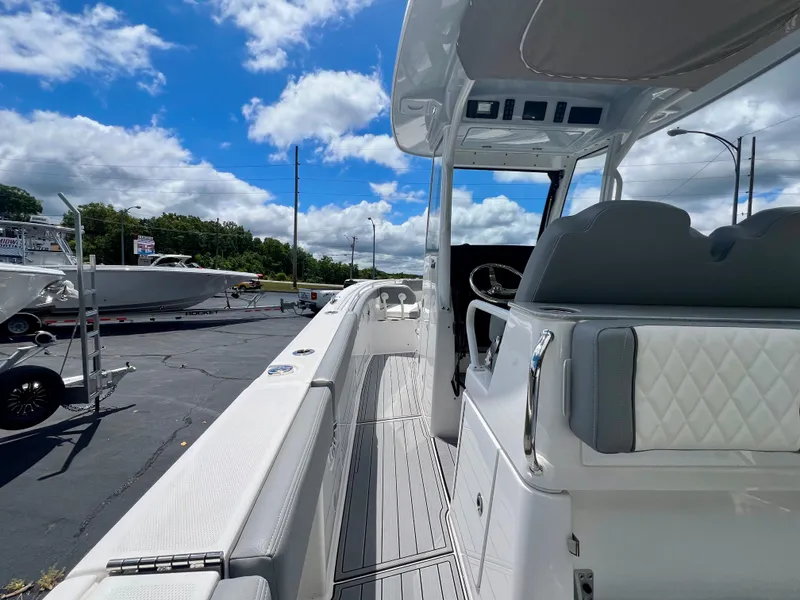 Slide: The Image of 2024 Everglades 285 Center Console boat with sleek design and modern features. - 11