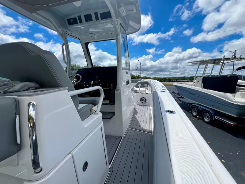 Slide: The Image of 2024 Everglades 285 Center Console boat with sleek design and modern features. - 12