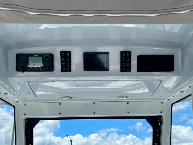 Slide: The Image of 2024 Everglades 285 Center Console dashboard with electronic controls and navigation system. - 18