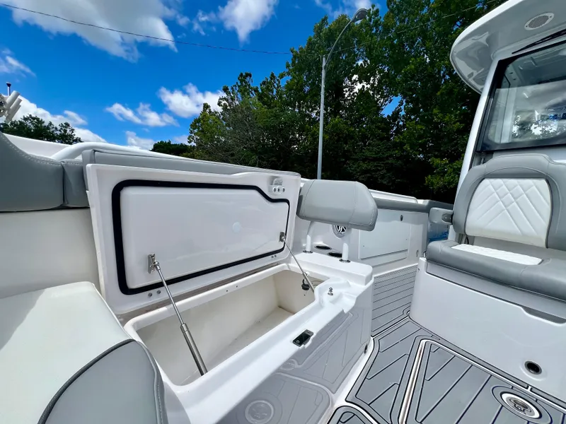 Slide: The Image of 2024 Everglades 285 Center Console boat interior with open storage compartment. - 37