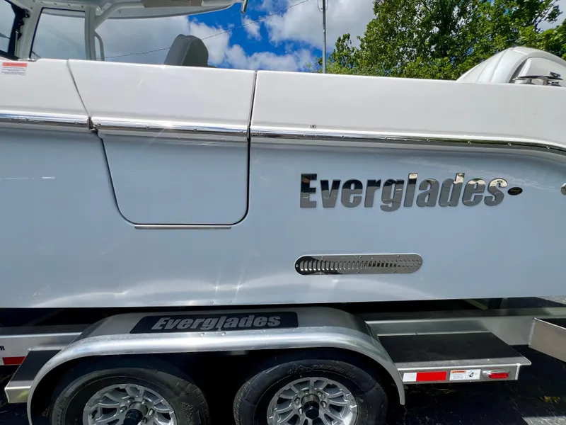 Slide: The Image of 2024 Everglades 285 Center Console boat on trailer, side view with logo. - 4